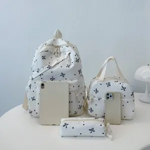 Mochila bonita con estampado de lazos y lunares para mujer, bolso escolar casual diario.