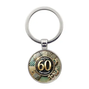 Detailed view of a circular 60th birthday keychain with gold and black decorative patterns