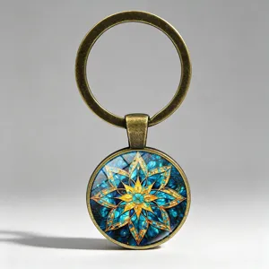 Detailed view of vintage mandala keychain with blue and gold stained glass pattern