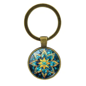 Vintage bronze mandala keychain with blue and gold eight-pointed star glass cabochon