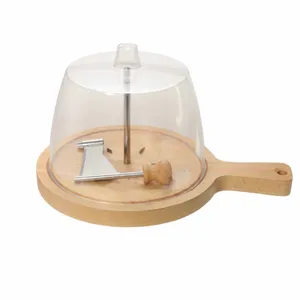 Manual cheese curler with wooden board and clear dome cover, perfect for chocolate and cheese.