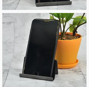 Close-up of a 304 stainless steel business card holder used as a sturdy desktop phone stand