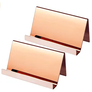 Pair of minimalist rose gold stainless steel business card holders for desktop office use