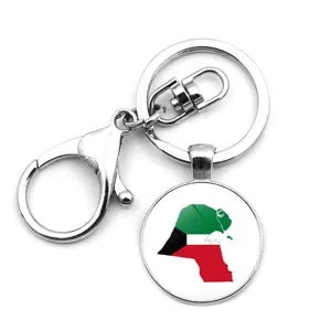 Detailed view of a silver keychain with a Kuwait map pendant in national flag colors.