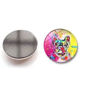Close-up of a 25mm glass fridge magnet featuring a colorful French Bulldog oil painting.