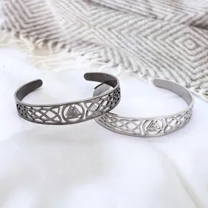 Detailed view of the intricate Viking Celtic knot and Valknut engraved on the steel cuff
