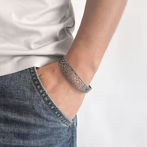 Detailed macro view of retro Viking Celtic knot hollow titanium steel cuff bracelet
