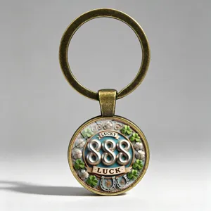 Close-up of metal keychain with lucky 888 pendant, shamrocks and horseshoe details.