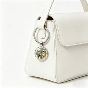 Detail of metal nurse keychain with 'Strongest Hearts' quote on a white bag.