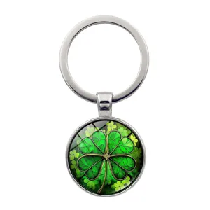 Detail of a vibrant green four-leaf clover glass cabochon keychain pendant charm
