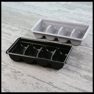 Kitchen 4-compartment cutlery storage tray detail view, plastic fork and knife holder.