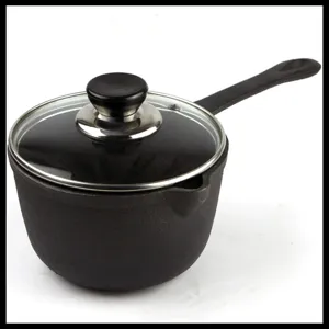 Detailed side view of a 16cm black cast iron milk pot with a transparent glass lid