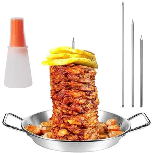 Detail shot of vertical barbecue skewer set with stainless steel pan, spikes and oil bottle.