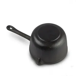 Close-up view of the bottom of a 16cm uncoated black cast iron milk pan for induction