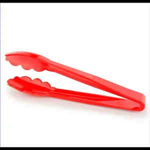 Close-up view of red heat-resistant plastic food tongs for bread and pastry buffet use