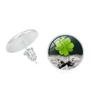 Detailed macro view showing the green four-leaf clover pattern inside a glass stud.