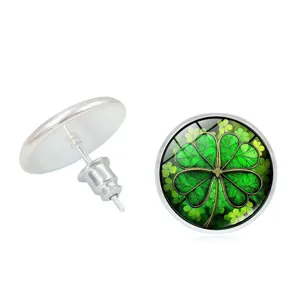 Detailed view of lucky four-leaf clover stud earrings with silver-tone backing.