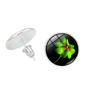 Detail view of four-leaf clover stud earrings showing front pattern and back structure.