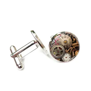Close-up of steampunk cufflinks featuring vintage mechanical gear and clock face designs.