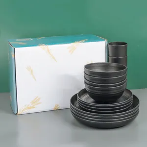 Black wheat straw dinnerware set including bowls, plates, and cups with gift box.