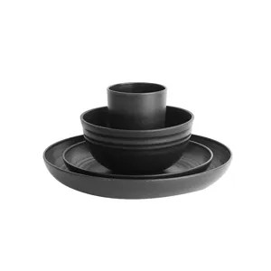 Black wheat straw tableware set including dinner plates, bowls and cups for home kitchen dining.