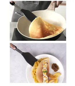 Silicone kitchen spatula with wood grain handle for non-stick pans cooking and flipping.