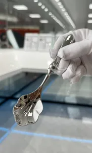 Luxury stainless steel dessert spoon with shell-shaped head and gourd handle detail