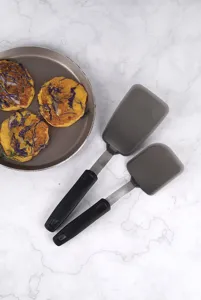 Silicone kitchen spatula set with black handles and stainless core for daily cooking.