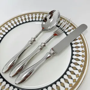 Luxury forged 304 stainless steel cutlery set with elegant gourd handles on a plate
