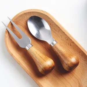 Premium two-piece cheese fork and spoon set with rounded wood handles on wooden tray