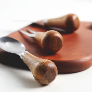 Vertical standing butter knife set with ergonomic wooden handles and steel heads