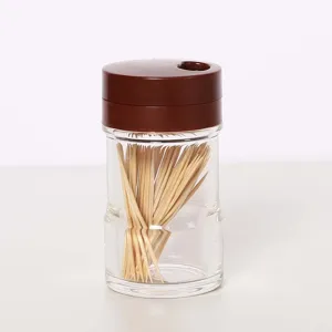 Detail of transparent acrylic seasoning jar with a dark brown lid for kitchen use
