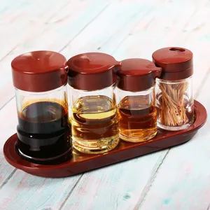 4-piece acrylic seasoning bottle set with red lids and matching tray for kitchen use