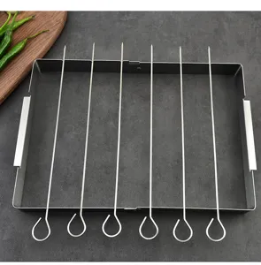 Detail shot of stainless steel BBQ skewer rack with skewers for outdoor grilling.