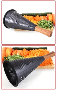 Close-up of black cone-shaped stainless steel vegetable grater with wooden handle