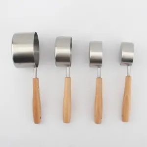 Set of four stainless steel measuring cups with natural beech wood handles.