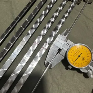 Detailed view of measuring a stainless steel round BBQ skewer using a precision dial caliper