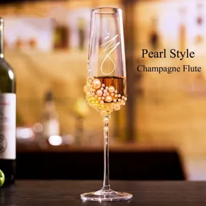 Elegant European style champagne flute glass decorated with white pearls for weddings.