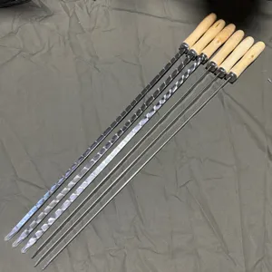Set of 6 stainless steel BBQ skewers with wooden handles, including flat and round needles.