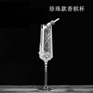Elegant European style champagne flute glass decorated with luxury white pearls.