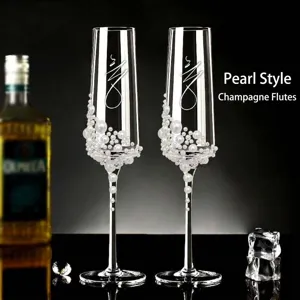 Elegant handcrafted champagne flute glass set featuring exquisite pearl decorations for weddings