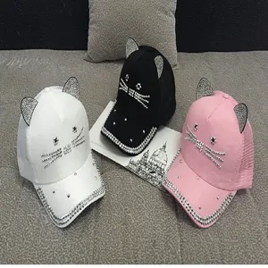 Detail view of three colors of cute rhinestone cat ear baseball caps with mesh back
