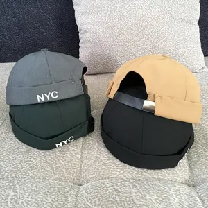 Detailed view of fashionable docker hat, short brimless cap, streetwear unisex hip hop cap.