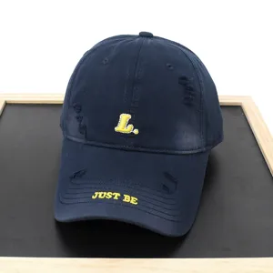 Distressed dark blue baseball cap with letter embroidery, casual streetwear hat for spring.