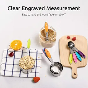 Close-up of stainless steel measuring set with colorful silicone handles and engraved scales.