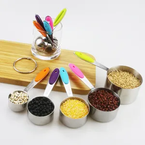 Close-up of 10-piece stainless steel measuring cup set with colorful silicone handles