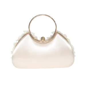 Champagne sequin evening bag with gold metal round handle, elegant clutch for party.