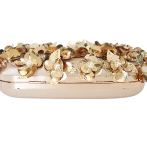 Gold sequin evening clutch handbag with floral pearls for wedding party and formal dress.