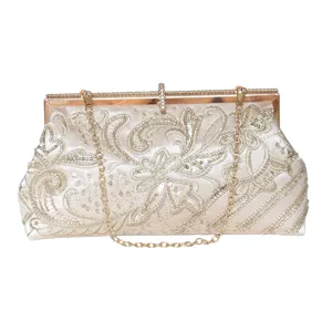 Handcrafted beaded sequin evening clutch bag with chain strap and metallic clasp closure.