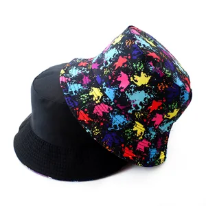Reversible bucket hat for men and women, trendy splash ink design, casual sun protection.